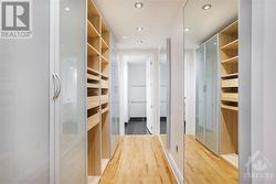 Primary bedroom walk-in closet with built in closet storage - 