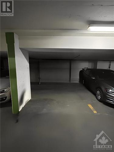 Underground garage parking included - 364 Cooper Street Unit#403, Ottawa, ON - Indoor Photo Showing Garage