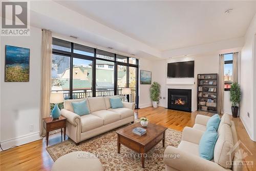 403 - 364 Cooper Street, Ottawa, ON - Indoor Photo Showing Living Room With Fireplace