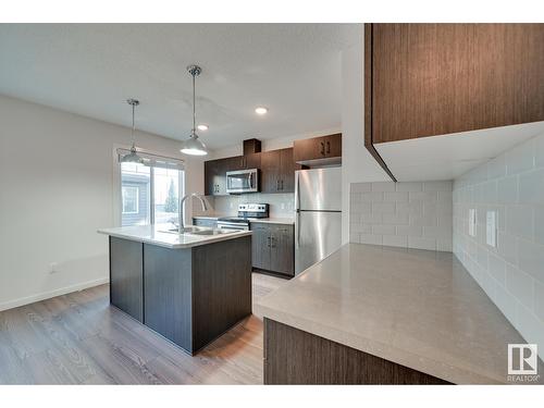 #24 2215 24 St Nw, Edmonton, AB - Indoor Photo Showing Kitchen With Stainless Steel Kitchen