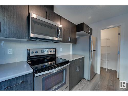 #24 2215 24 St Nw, Edmonton, AB - Indoor Photo Showing Kitchen With Stainless Steel Kitchen