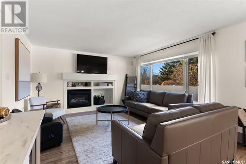 1336 Smishek Drive N, Regina, SK - Indoor Photo Showing Living Room With Fireplace