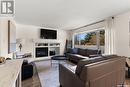 1336 Smishek Drive N, Regina, SK  - Indoor Photo Showing Living Room With Fireplace 