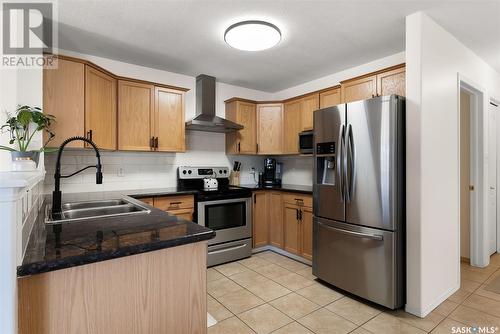 1336 Smishek Drive N, Regina, SK - Indoor Photo Showing Kitchen With Double Sink