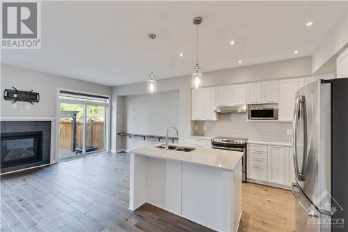 760 Carnelian Crescent, Ottawa, ON - Indoor Photo Showing Kitchen With Fireplace With Double Sink With Upgraded Kitchen