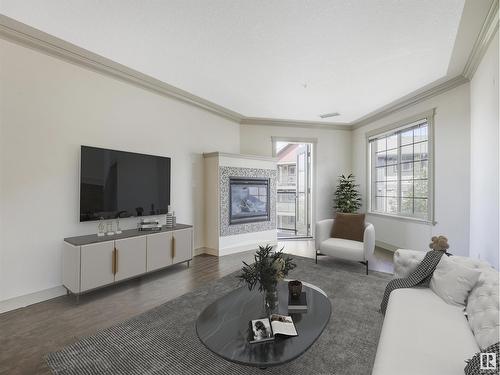 #303 16235 51 St Nw Nw, Edmonton, AB - Indoor Photo Showing Living Room With Fireplace