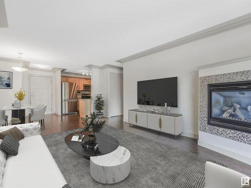 #303 16235 51 St Nw Nw, Edmonton, AB - Indoor Photo Showing Living Room With Fireplace