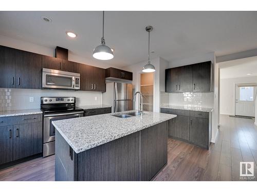 #7 2215 24 St Nw, Edmonton, AB - Indoor Photo Showing Kitchen With Stainless Steel Kitchen With Double Sink