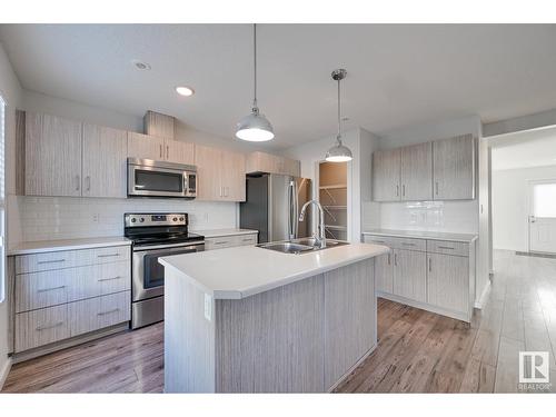 #6 2215 24 St Nw, Edmonton, AB - Indoor Photo Showing Kitchen With Stainless Steel Kitchen With Double Sink With Upgraded Kitchen