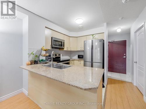 Ample Counter Space - 309 - 7405 Goreway Drive, Mississauga (Malton), ON - Indoor Photo Showing Kitchen With Stainless Steel Kitchen With Double Sink