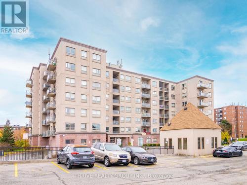 Ample Above Ground Visitor Parking - 309 - 7405 Goreway Drive, Mississauga (Malton), ON - Outdoor With Balcony With Facade