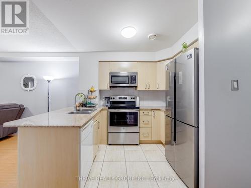 Stainless Steel Appliances - 309 - 7405 Goreway Drive, Mississauga (Malton), ON - Indoor Photo Showing Kitchen With Stainless Steel Kitchen With Double Sink