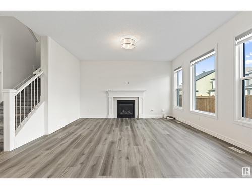 1635 16 St Nw, Edmonton, AB - Indoor Photo Showing Living Room With Fireplace