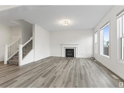 1635 16 St Nw, Edmonton, AB - Indoor Photo Showing Living Room With Fireplace