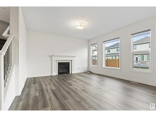 1635 16 St Nw, Edmonton, AB - Indoor Photo Showing Living Room With Fireplace