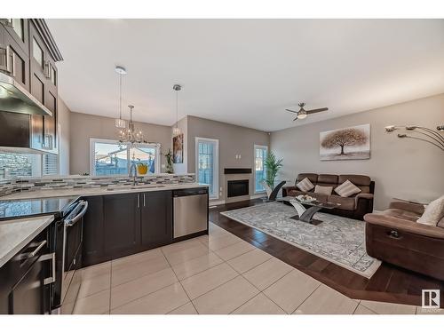 2406 22 Av Nw, Edmonton, AB - Indoor Photo Showing Other Room With Fireplace