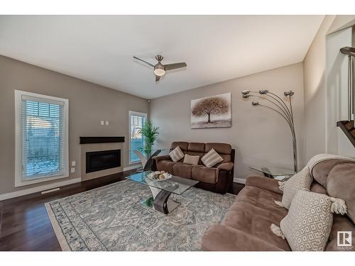 2406 22 Av Nw, Edmonton, AB - Indoor Photo Showing Living Room With Fireplace