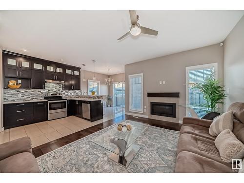 2406 22 Av Nw, Edmonton, AB - Indoor Photo Showing Living Room With Fireplace