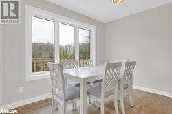 Dining room with light hardwood / wood-style floors - 