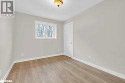 Empty room with light hardwood / wood-style flooring - 