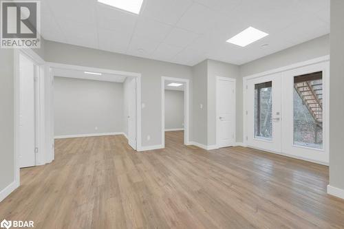 Empty room featuring light hardwood / wood-style floors and french doors - 530 Addington Road 5, Cloyne, ON - Indoor Photo Showing Other Room