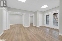 Empty room featuring light hardwood / wood-style floors and french doors - 