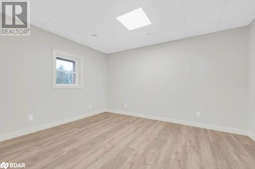 Spare room with light hardwood / wood-style floors and a paneled ceiling - 530 Addington Road 5, Cloyne, ON - Indoor Photo Showing Other Room