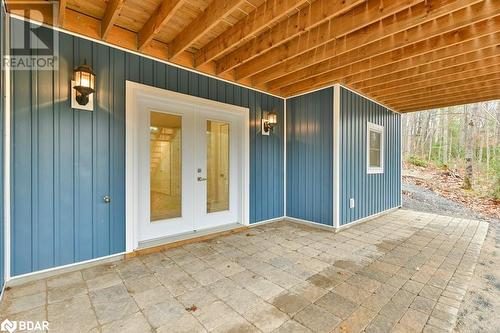 Entrance to property with a patio and french doors - 530 Addington Road 5, Cloyne, ON - Outdoor With Exterior