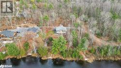 Birds eye view of property with a water view - 