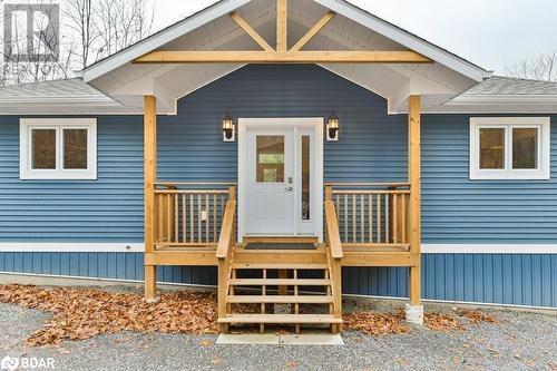 Doorway to property featuring a deck - 530 Addington Road 5, Cloyne, ON - Outdoor With Facade