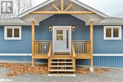 Doorway to property featuring a deck - 