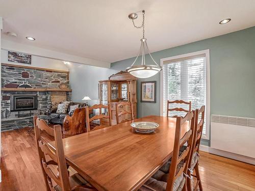 Salle Ã  manger - 375 Rue Des Libellules, Saint-Colomban, QC - Indoor Photo Showing Dining Room With Fireplace