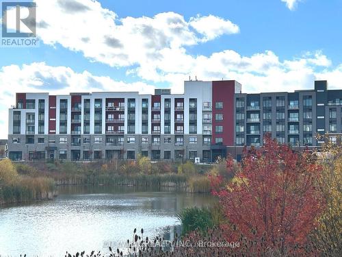 109 - 3265 Carding Mill Trail, Oakville, ON - Outdoor With Balcony With Facade