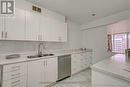 902 - 25 Four Winds Drive, Toronto, ON  - Indoor Photo Showing Kitchen With Double Sink 