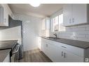 9H Clareview Vg Nw, Edmonton, AB  - Indoor Photo Showing Kitchen With Double Sink 