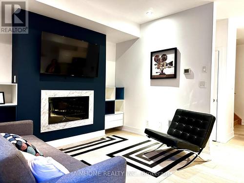 112 - 42 Curzon Street, Toronto, ON - Indoor Photo Showing Living Room With Fireplace