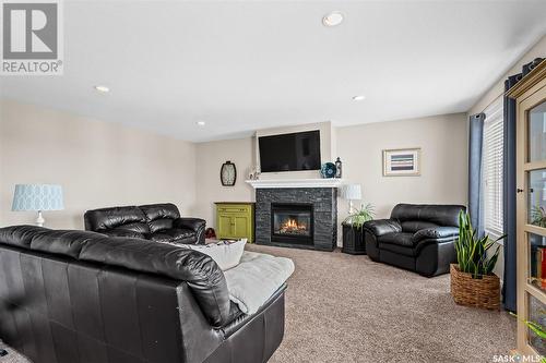 19 Wellington Place, Moose Jaw, SK - Indoor Photo Showing Living Room With Fireplace