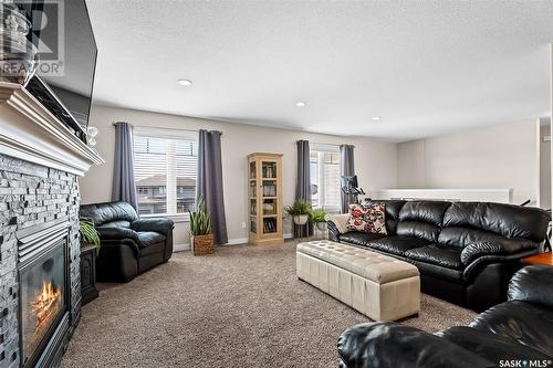 19 Wellington Place, Moose Jaw, SK - Indoor Photo Showing Living Room With Fireplace