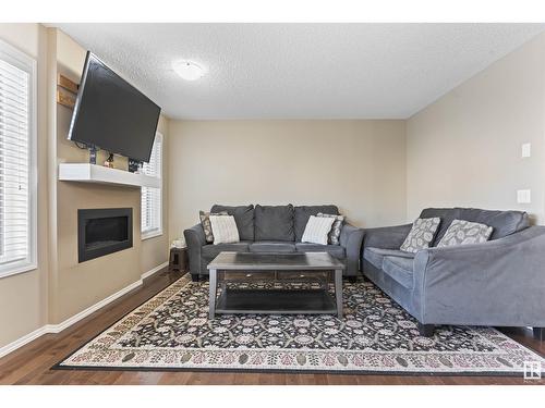 3104 16 Av Nw, Edmonton, AB - Indoor Photo Showing Living Room With Fireplace