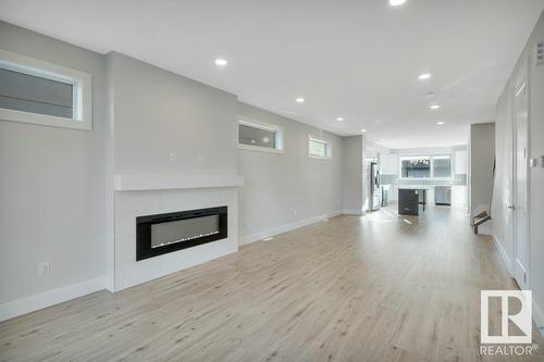 8719 88 Av Nw, Edmonton, AB - Indoor Photo Showing Living Room With Fireplace