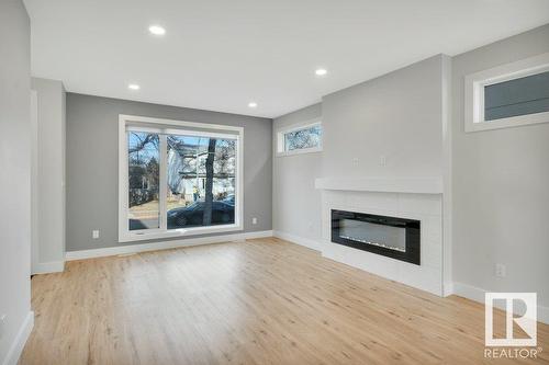 8719 88 Av Nw, Edmonton, AB - Indoor Photo Showing Living Room With Fireplace