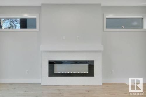 8719 88 Av Nw, Edmonton, AB - Indoor Photo Showing Living Room With Fireplace