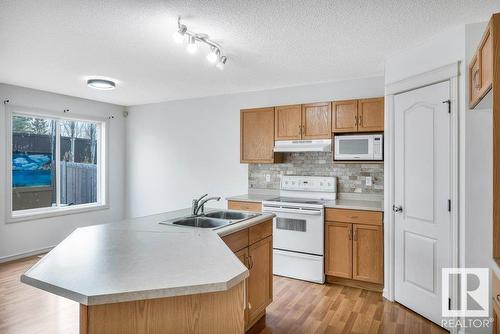 103 Rue Masson, Beaumont, AB - Indoor Photo Showing Kitchen With Double Sink