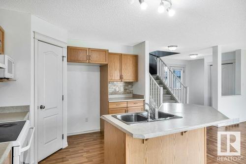 103 Rue Masson, Beaumont, AB - Indoor Photo Showing Kitchen With Double Sink