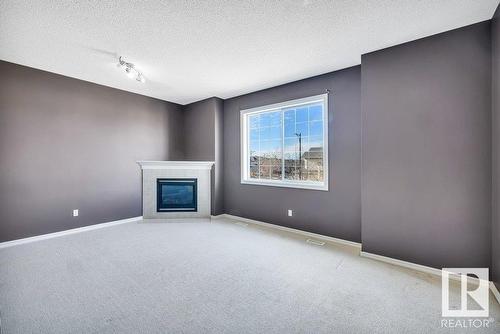 103 Rue Masson, Beaumont, AB - Indoor With Fireplace