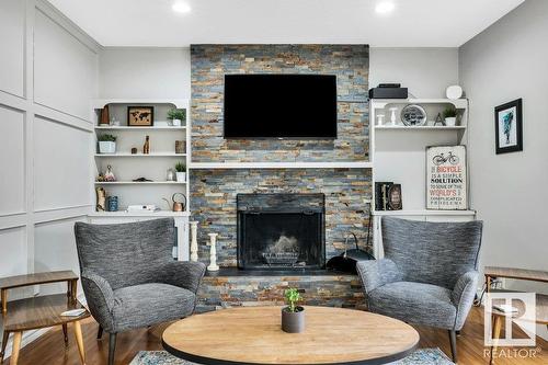 16 Westridge Cr Nw, Edmonton, AB - Indoor Photo Showing Living Room With Fireplace