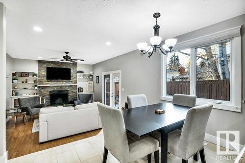 16 Westridge Cr Nw, Edmonton, AB - Indoor Photo Showing Dining Room With Fireplace