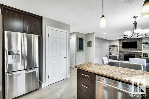 16 Westridge Cr Nw, Edmonton, AB - Indoor Photo Showing Kitchen With Fireplace