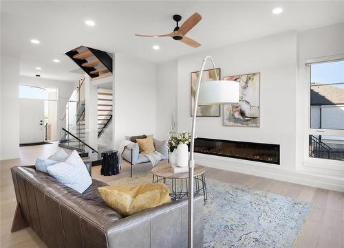 19 Sarsprilla Bend, Winnipeg, MB - Indoor Photo Showing Living Room With Fireplace