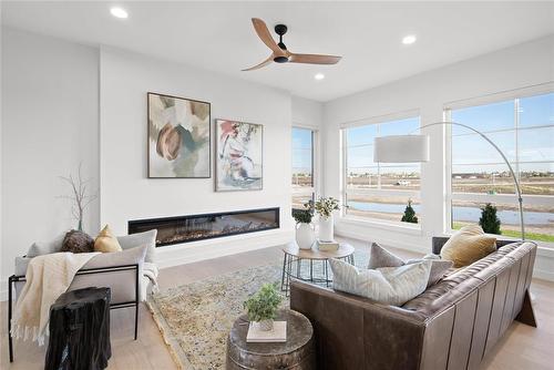 19 Sarsprilla Bend, Winnipeg, MB - Indoor Photo Showing Living Room With Fireplace